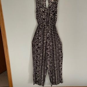 Patterned romper with a flowy bottoms. Worn once.